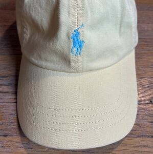 Yellow Polo Ralph Lauren baseball cap with blue embroidered logo.